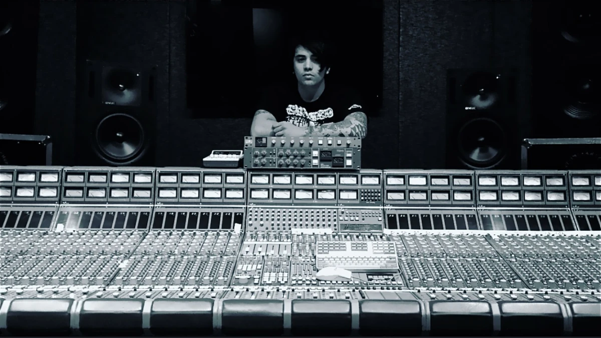 Eros Marcello at a large recording-studio mixing console
